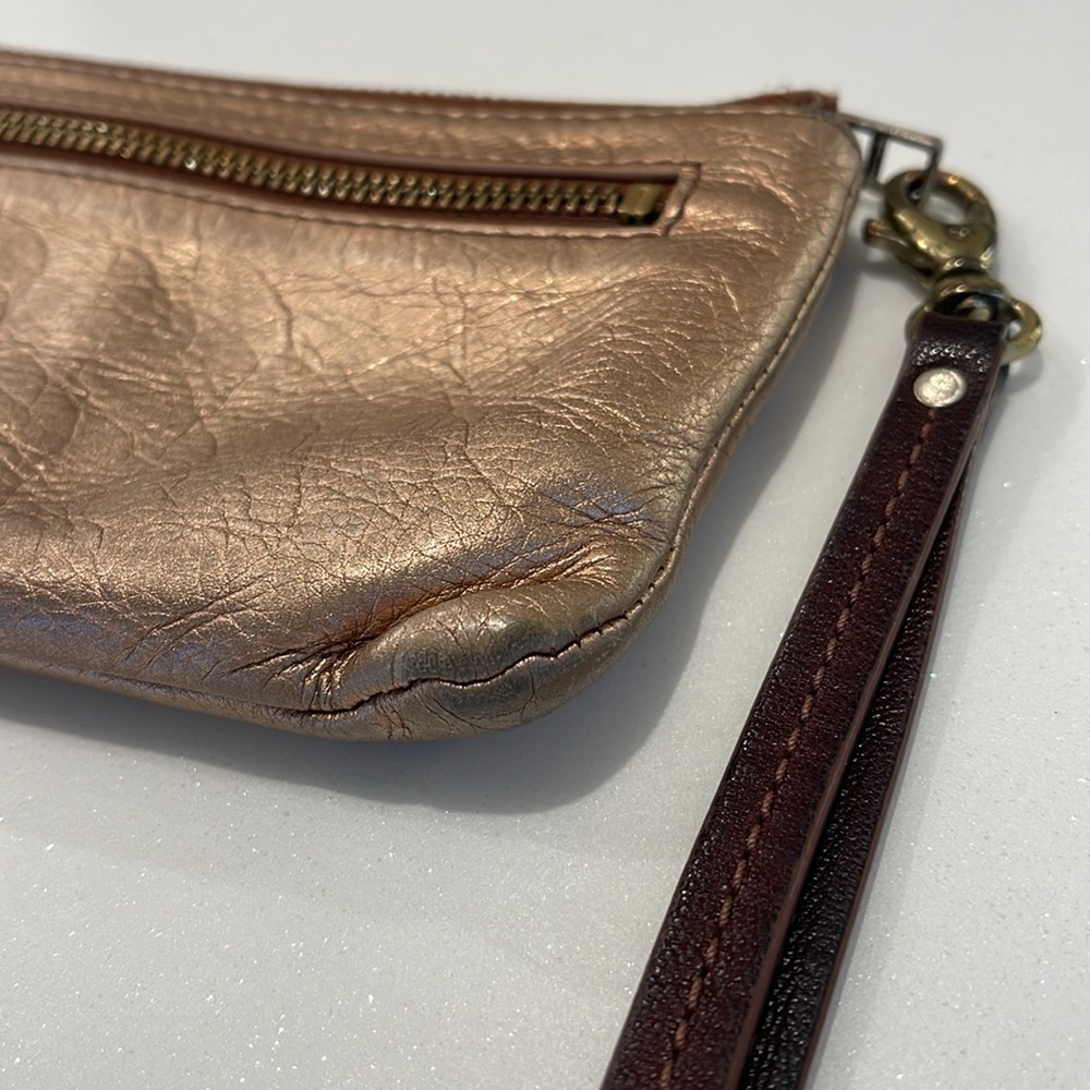 Fossil rose gold metallic leather wristlet clutch